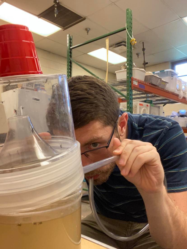 student conducting breathing exercise in mosquito experiment